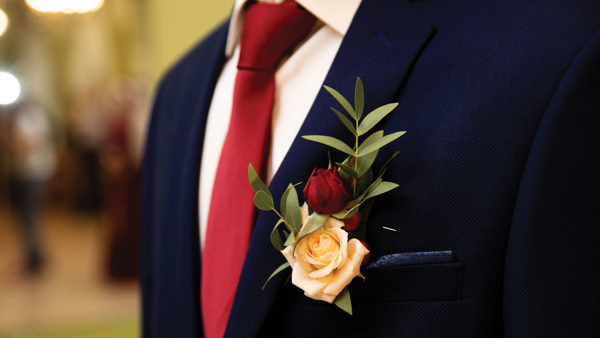 Dark blue suit, pink shirt, red tie